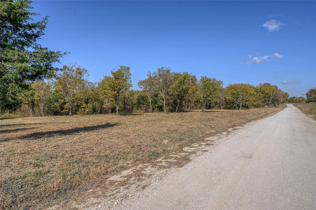 147 Shadow Trail Sherman, TX 75092 - Photo 8 of 10 a view of a field with trees in background