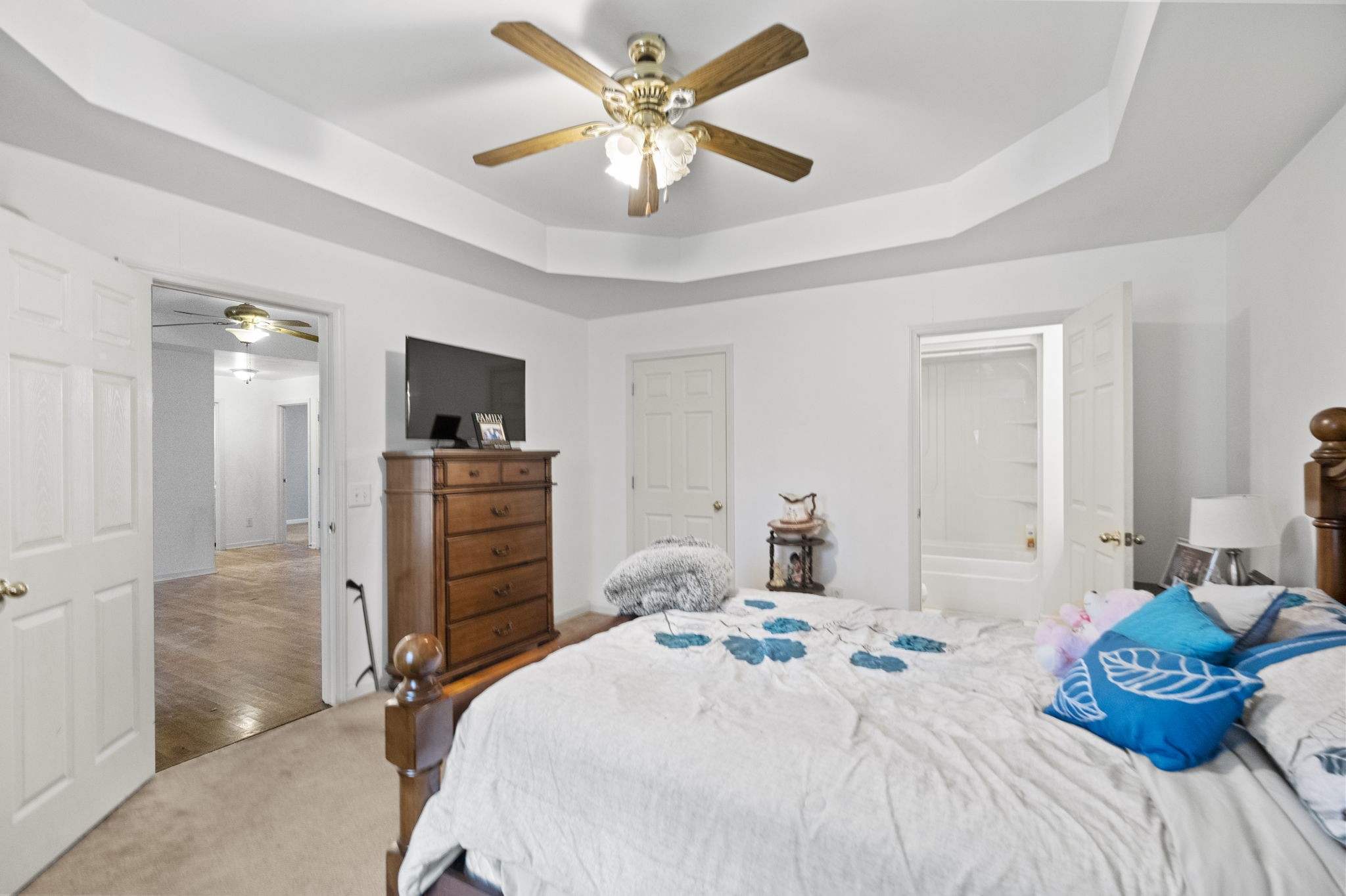 12480 Owens Chapel Road Springfield, TN 37172 - Photo 12 of 36 a bedroom with a bed and a chandelier