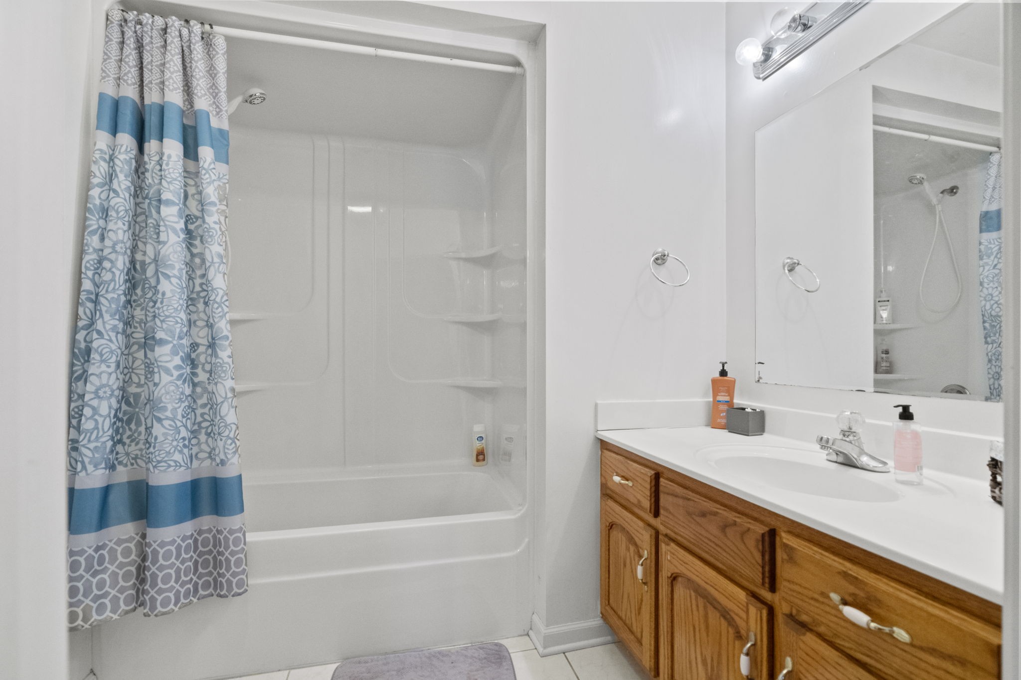 12480 Owens Chapel Road Springfield, TN 37172 - Photo 13 of 36 a bathroom with a tub sink and mirror