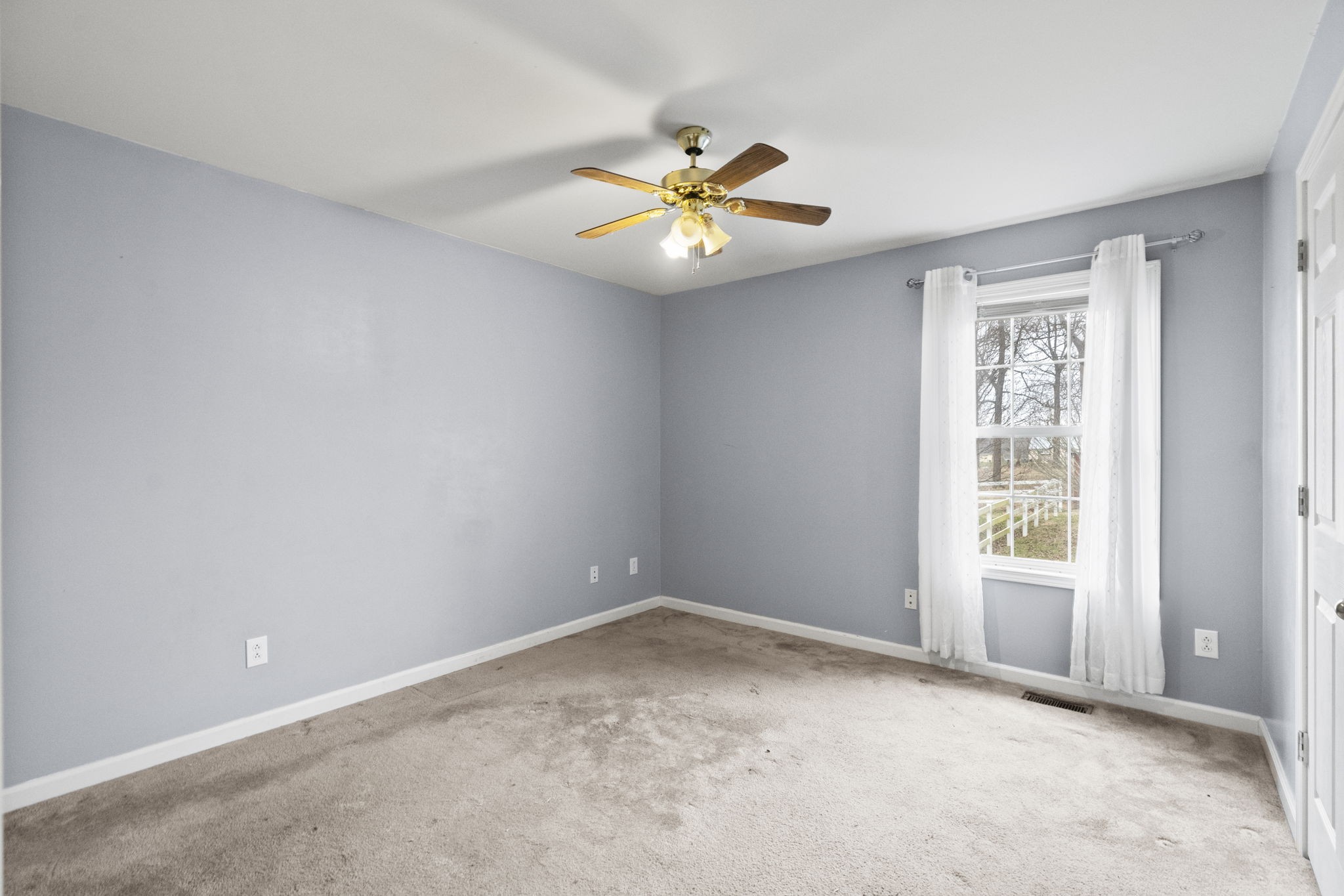 12480 Owens Chapel Road Springfield, TN 37172 - Photo 14 of 36 wooden floor in an empty room with a window