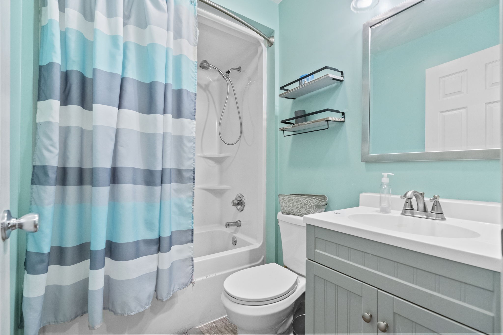 12480 Owens Chapel Road Springfield, TN 37172 - Photo 15 of 36 a bathroom with a sink toilet and shower