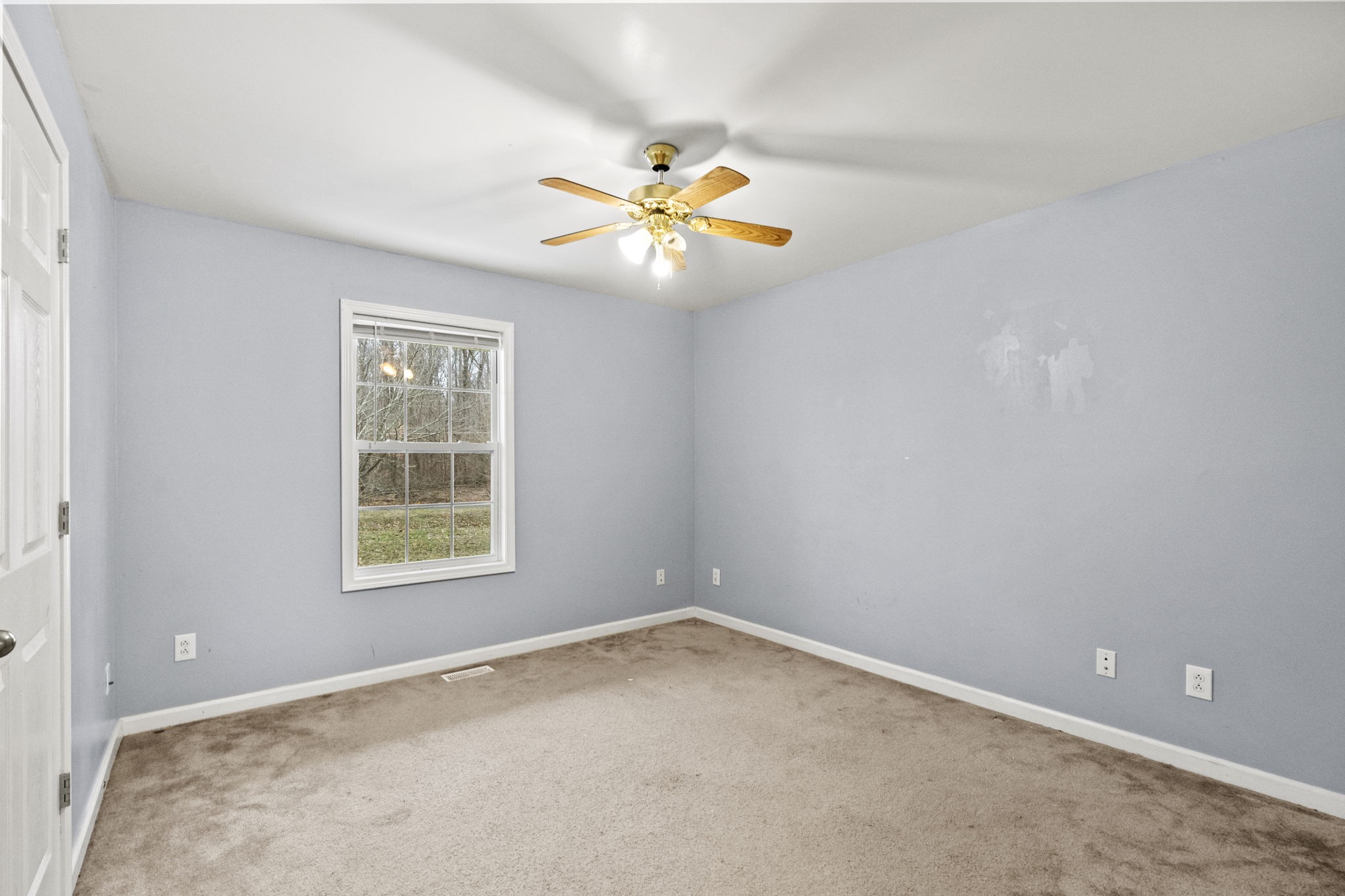 12480 Owens Chapel Road Springfield, TN 37172 - Photo 16 of 36 an empty room with windows and fan