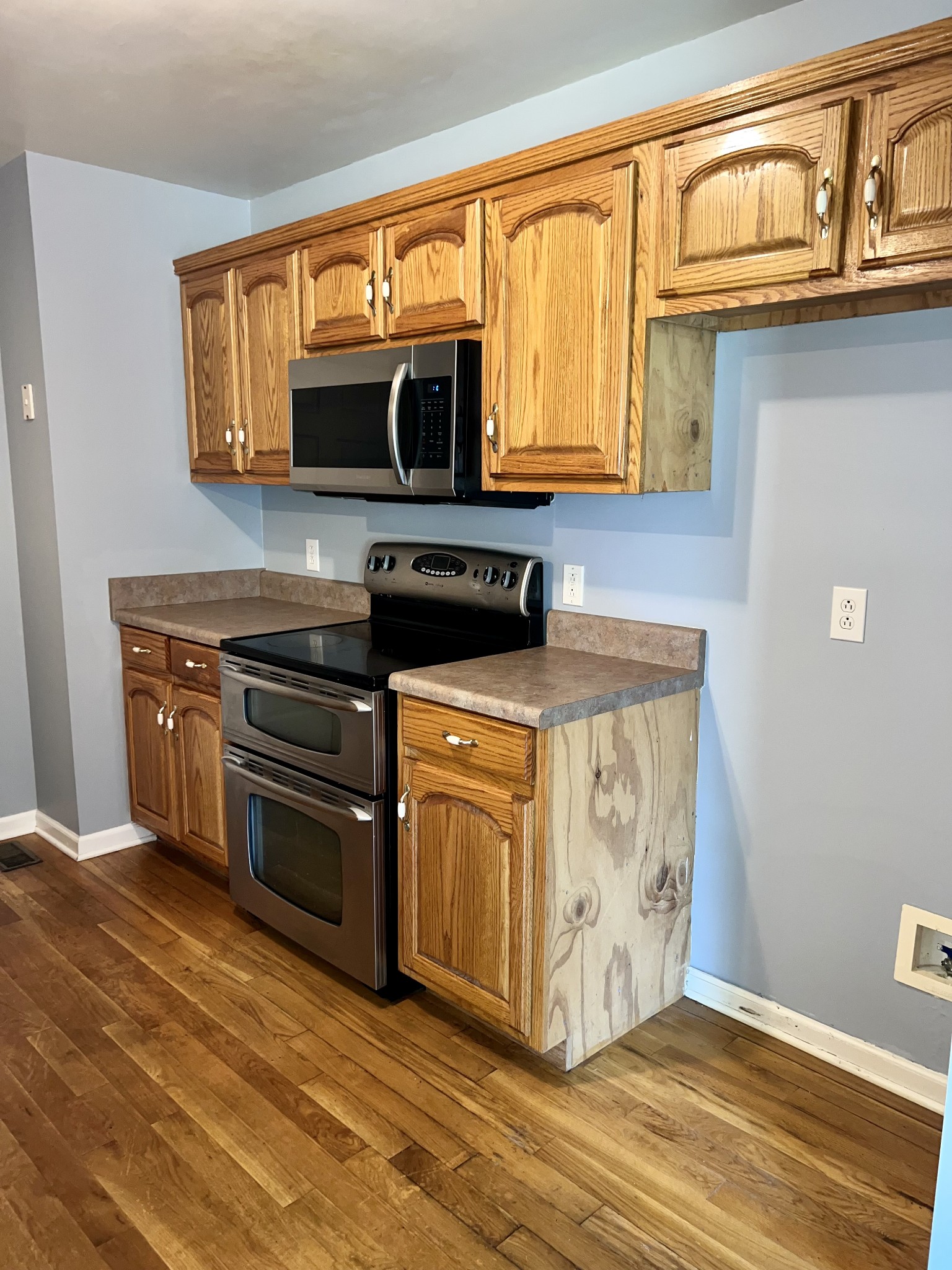 12480 Owens Chapel Road Springfield, TN 37172 - Photo 6 of 36 a kitchen with stainless steel appliances granite countertop a stove a sink and a microwave