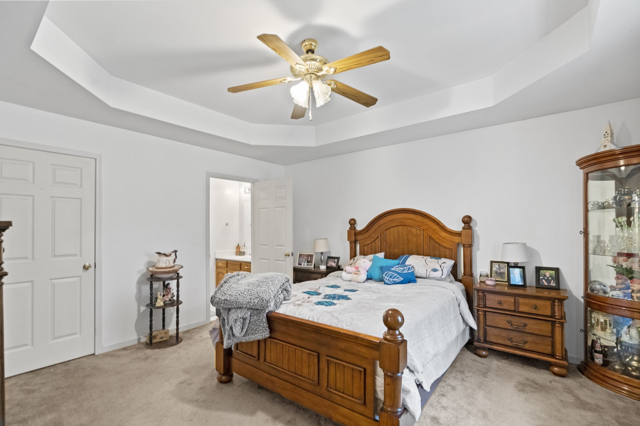 12480 Owens Chapel Road Springfield, TN 37172 - Photo 10 of 36 a bedroom with a bed and a chandelier