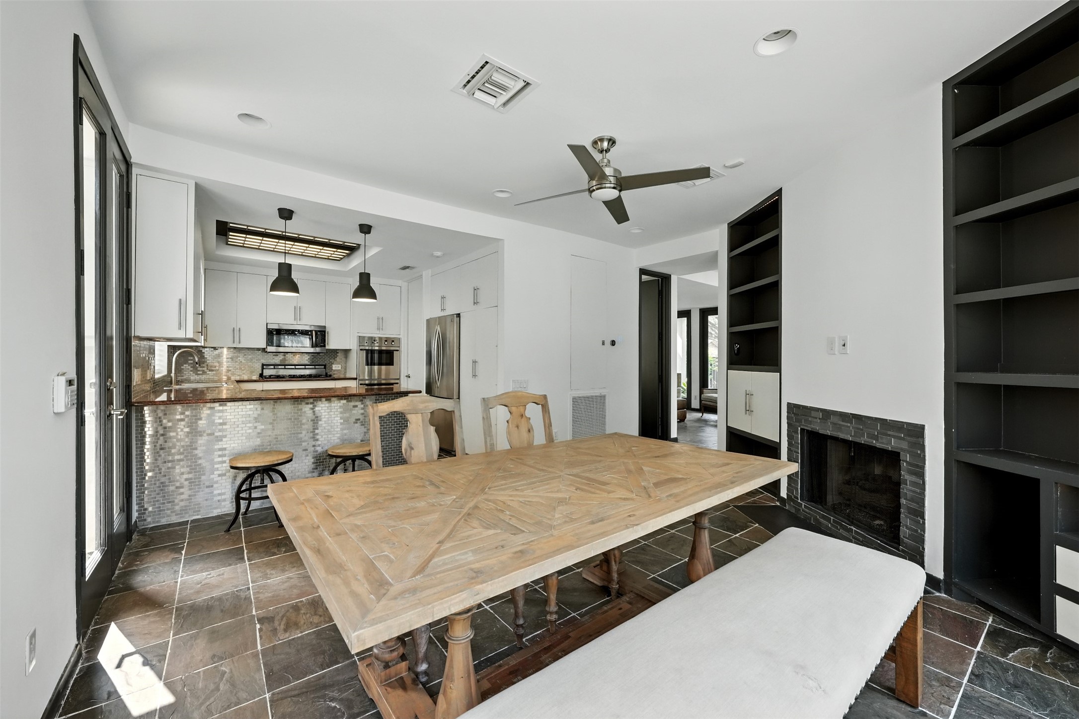 2019 McClendon Street Houston, TX 77030 - Photo 11 of 45 a living room with stainless steel appliances kitchen island granite countertop furniture and a kitchen view
