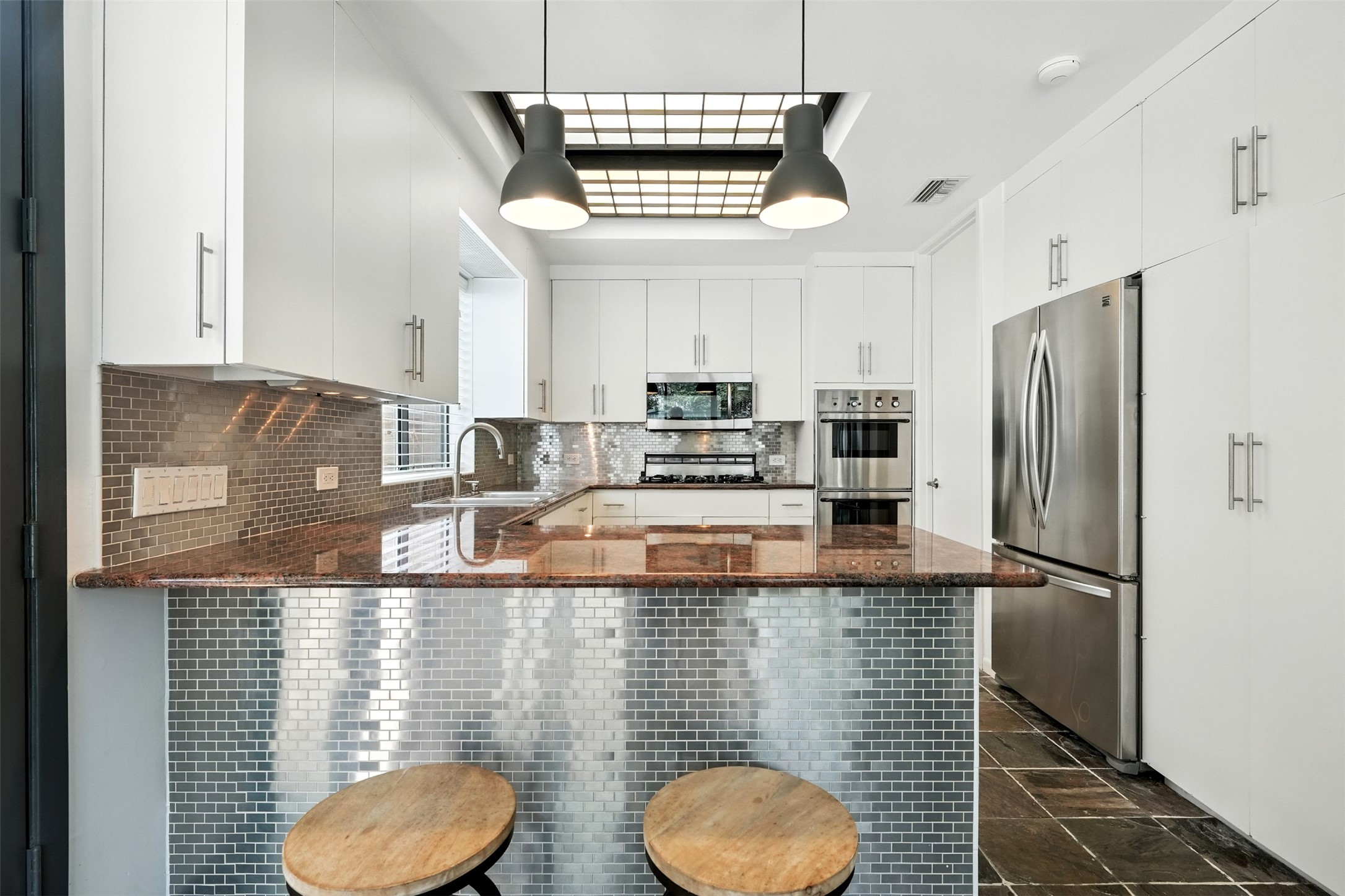 2019 McClendon Street Houston, TX 77030 - Photo 14 of 45 a kitchen with sink refrigerator and window
