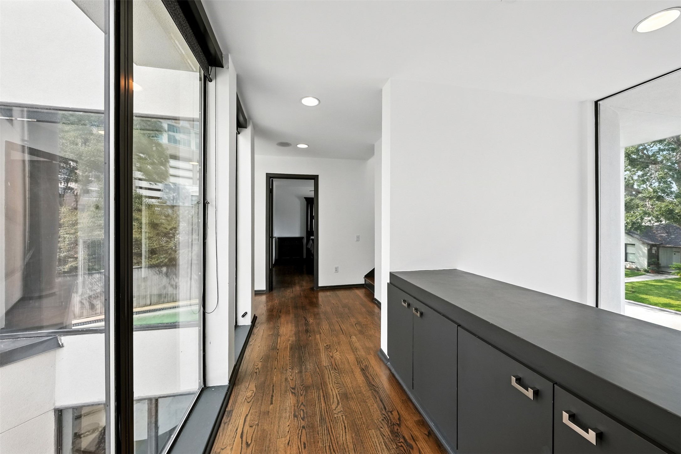 2019 McClendon Street Houston, TX 77030 - Photo 19 of 45 a kitchen with granite countertop a refrigerator a sink and wooden floor