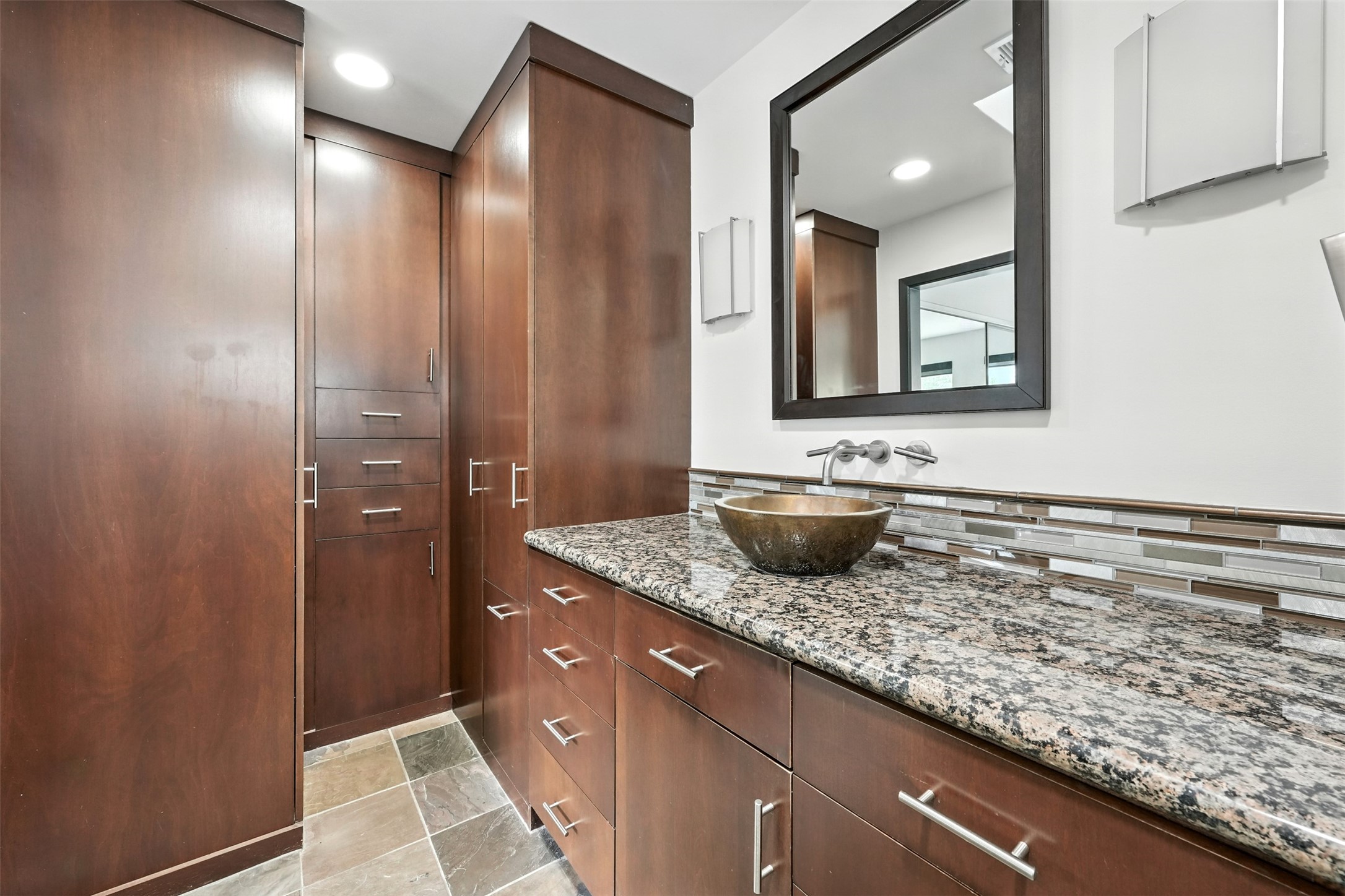 2019 McClendon Street Houston, TX 77030 - Photo 24 of 45 a bathroom with a sink and a mirror