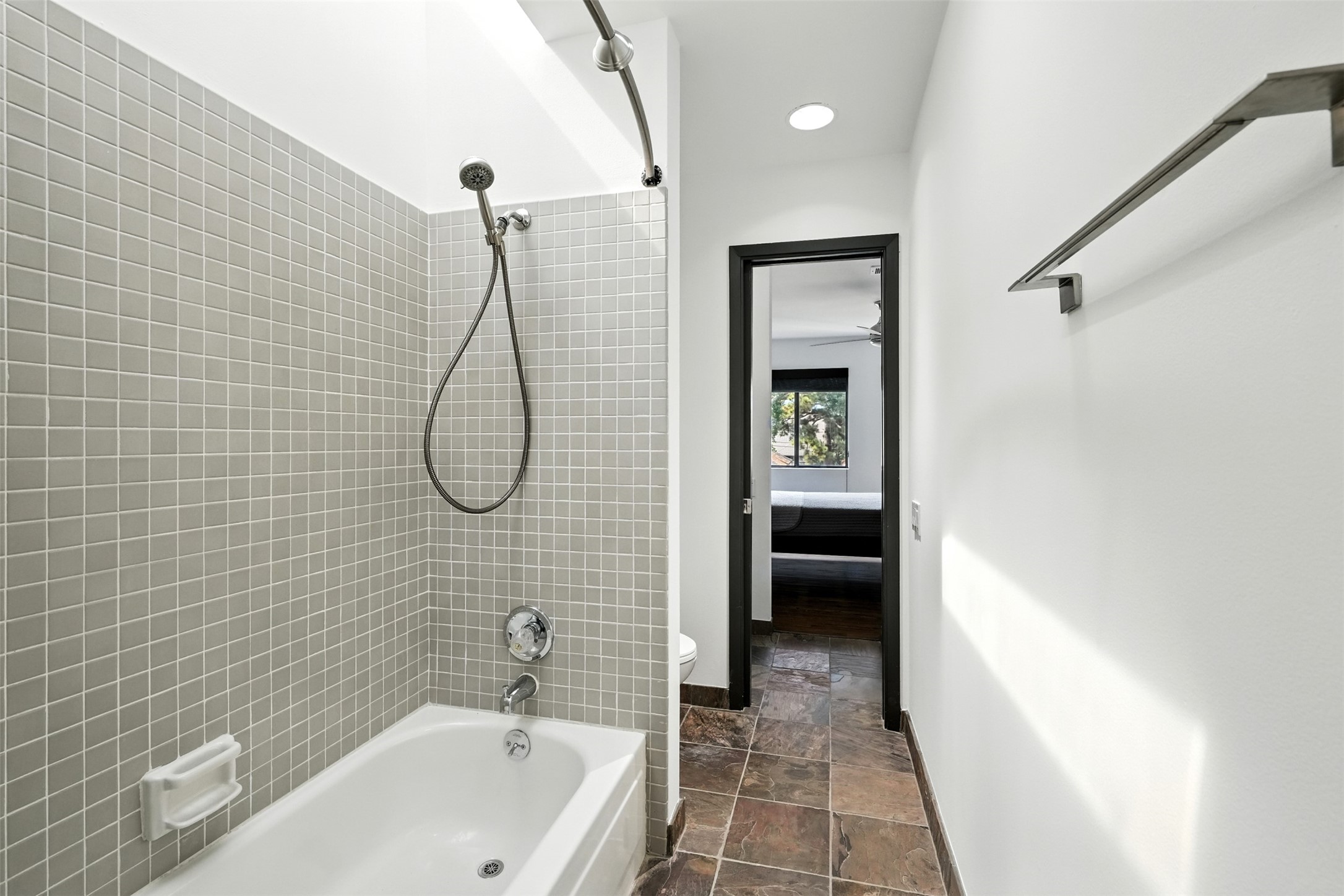 2019 McClendon Street Houston, TX 77030 - Photo 28 of 45 a bathroom with a bath tub with a shower