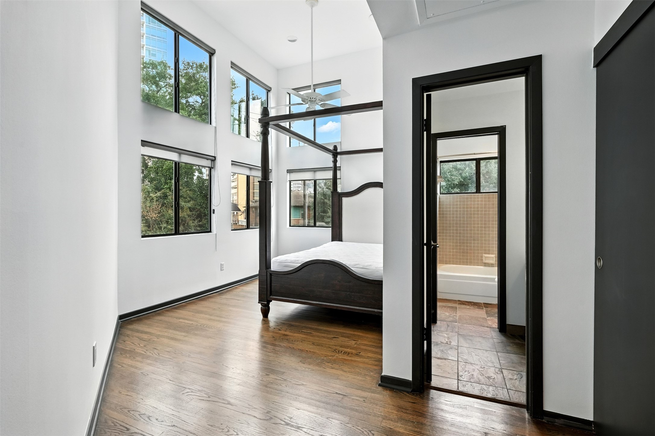 2019 McClendon Street Houston, TX 77030 - Photo 32 of 45 a balcony view with a large window and wooden floor