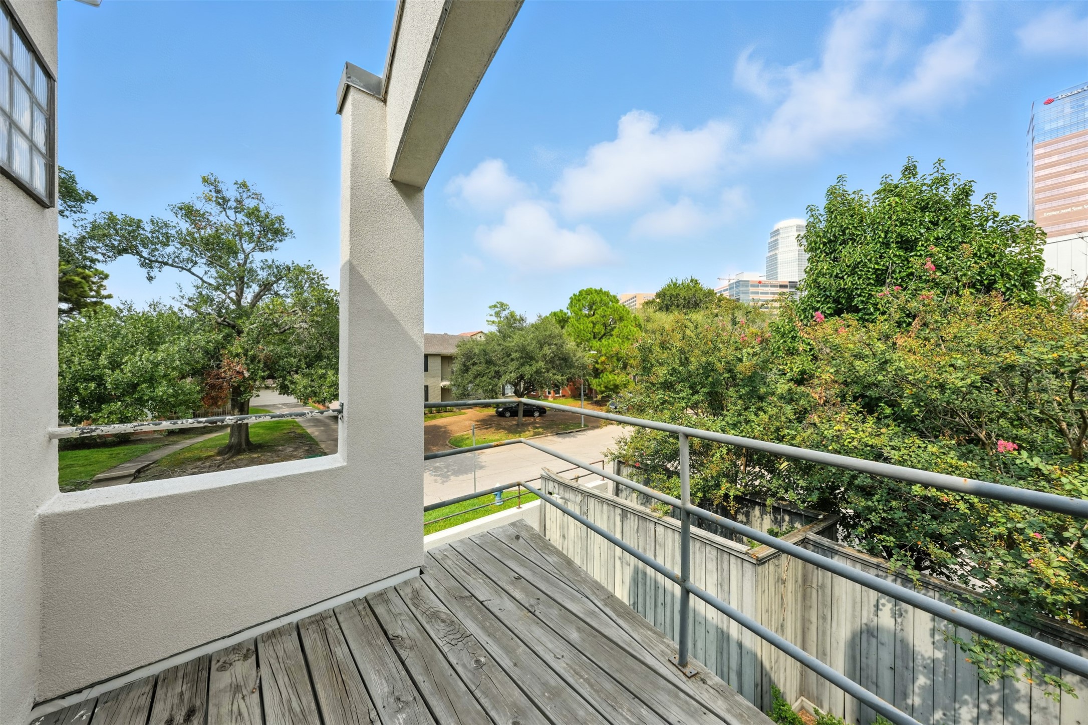 2019 McClendon Street Houston, TX 77030 - Photo 37 of 45 a view of balcony with wooden floor and fence