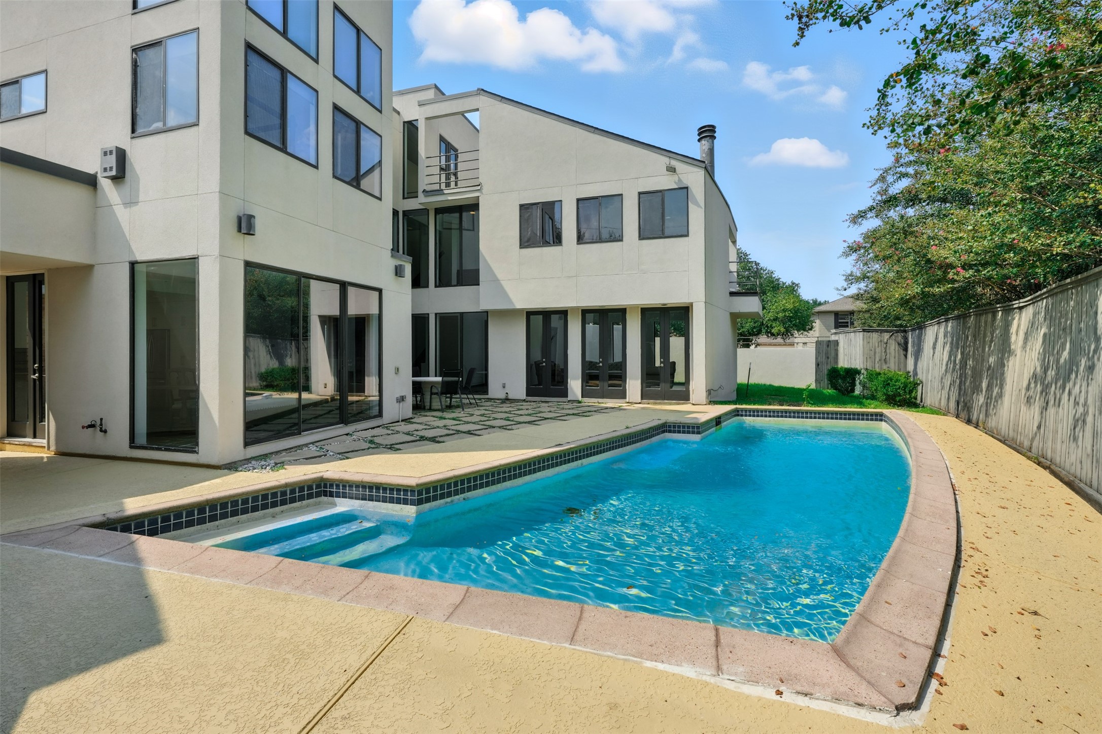 2019 McClendon Street Houston, TX 77030 - Photo 40 of 45 a view of a house with pool and a yard
