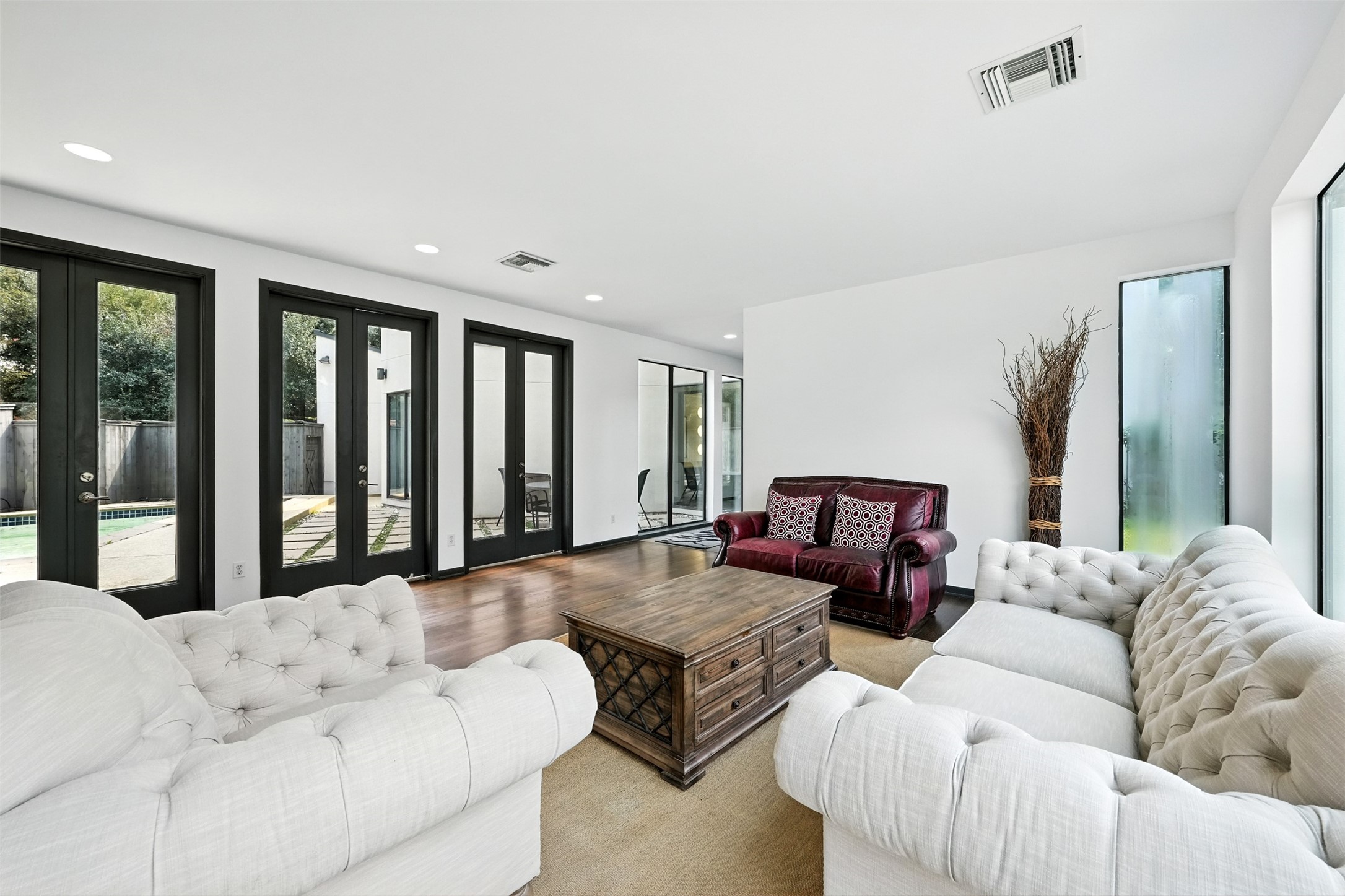 2019 McClendon Street Houston, TX 77030 - Photo 6 of 45 a living room with furniture large window and a flat screen tv