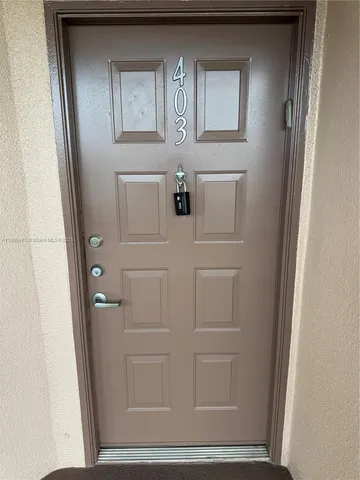 a view of elevator with wooden door
