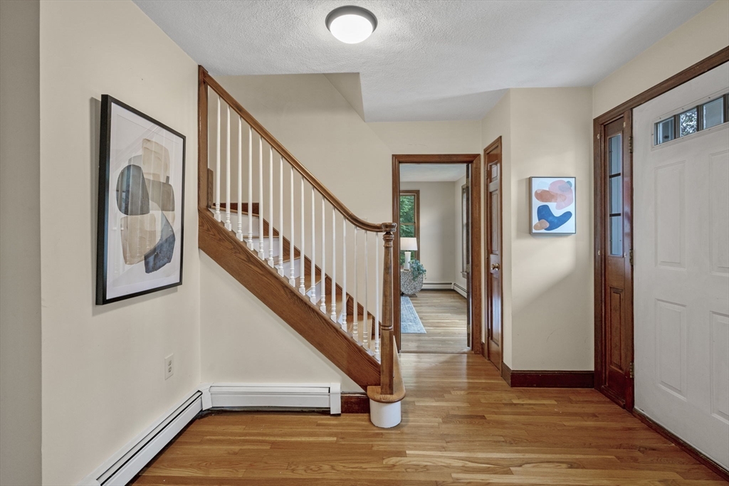 5 Ledgewood Road Saugus, MA 01906 - Photo 13 of 42 a view of entryway and hall with wooden floor