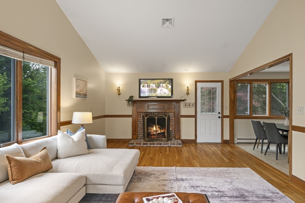 5 Ledgewood Road Saugus, MA 01906 - Photo 28 of 42 a living room with furniture large window and a fireplace