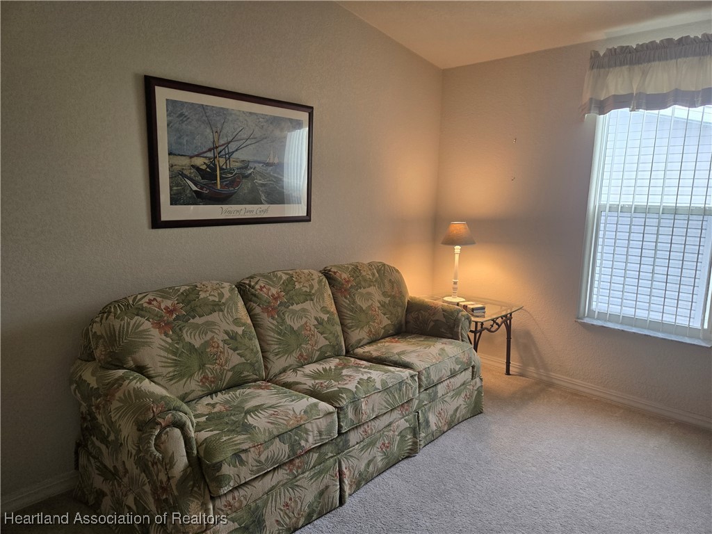 3312 Beartooth Pass Sebring, FL 33872 - Photo 15 of 39 a living room with furniture and a window