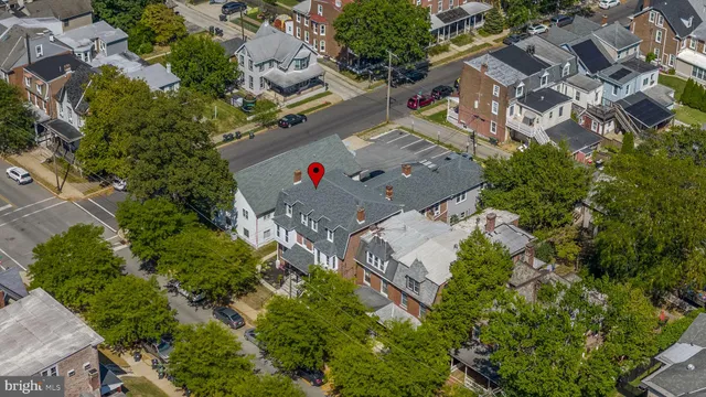 an aerial view of residential houses with outdoor space