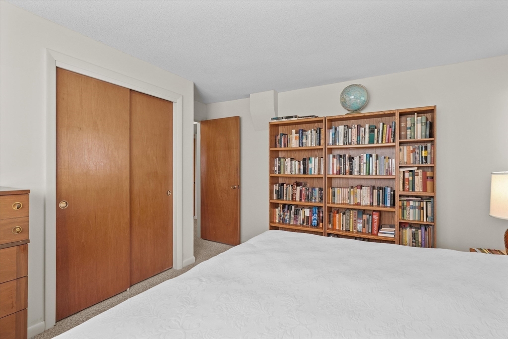 40 Ballardvale Road Andover, MA 01810 - Photo 22 of 36 a view of a bedroom with a book shelf