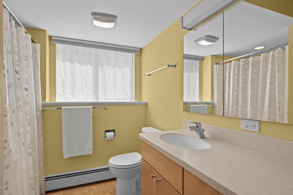 40 Ballardvale Road Andover, MA 01810 - Photo 24 of 36 a bathroom with a granite countertop sink and a mirror