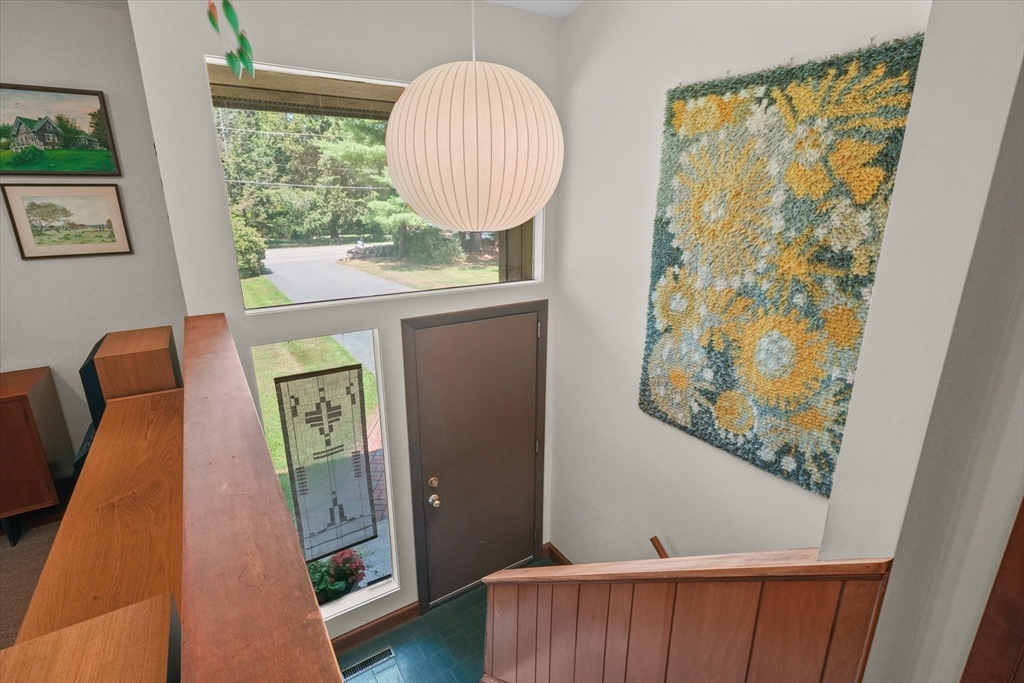 40 Ballardvale Road Andover, MA 01810 - Photo 3 of 36 a room with painting on the wall and a window