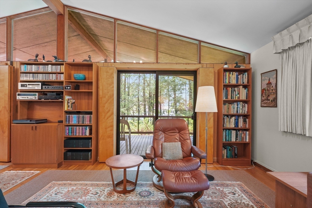 40 Ballardvale Road Andover, MA 01810 - Photo 6 of 36 a living room with furniture a rug and a book shelf