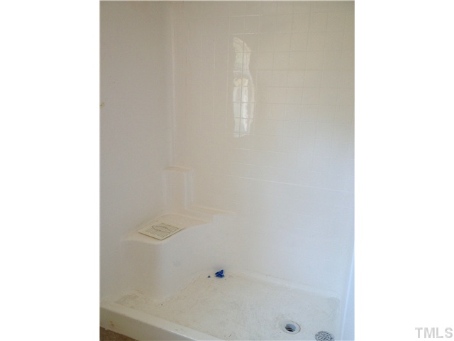 1104 Farmers Branch Road Willow Spring, NC 27592 - Photo 8 of 16 a bathroom with a shower