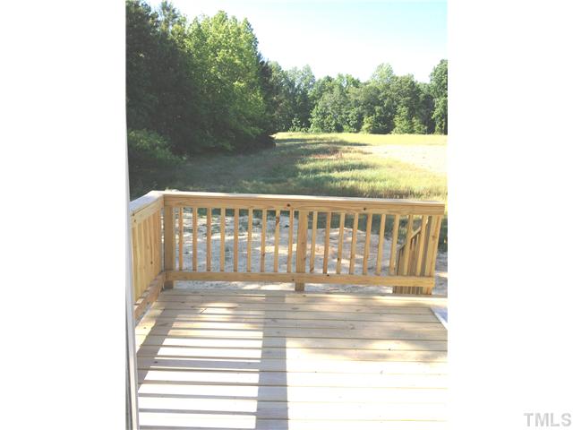 1104 Farmers Branch Road Willow Spring, NC 27592 - Photo 10 of 16 a view of a balcony