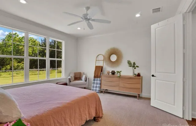 a bed room with a bed and a window