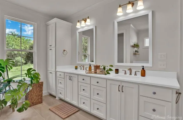 a bathroom with a double vanity sink and a mirror