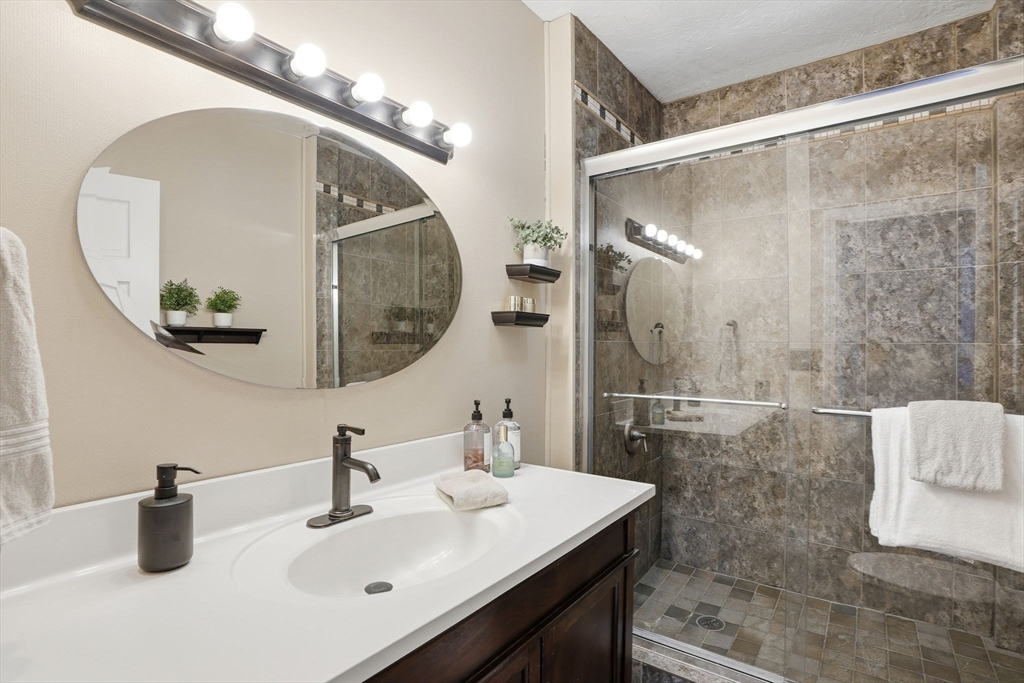 200 Branch Street Mansfield, MA 02048 - Photo 29 of 41 a bathroom with a sink and a mirror