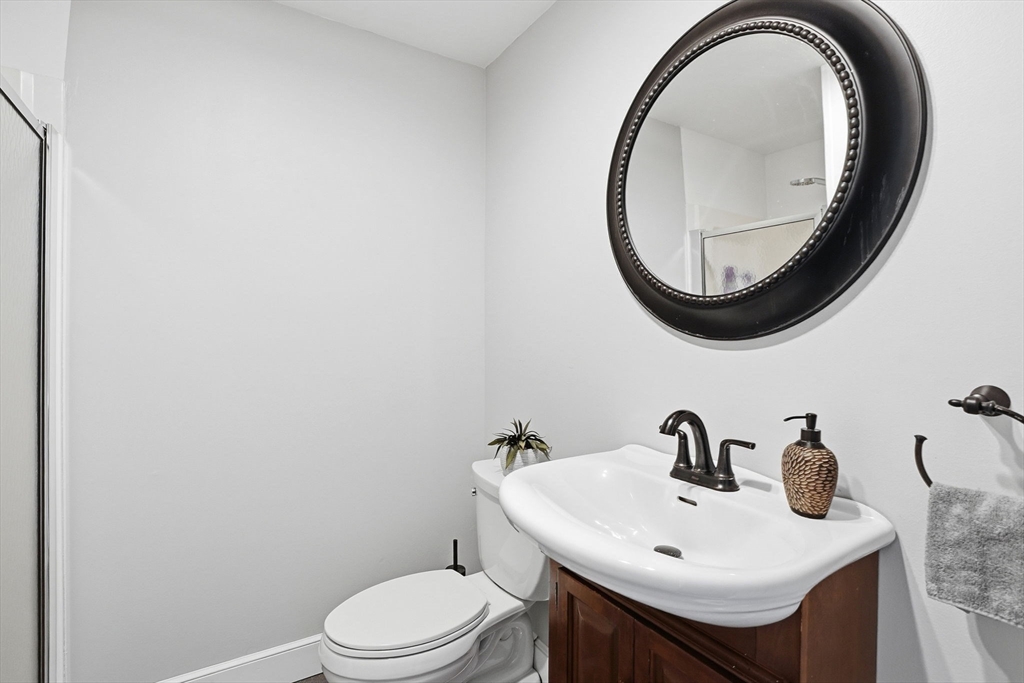 200 Branch Street Mansfield, MA 02048 - Photo 30 of 41 a bathroom with a sink and a mirror
