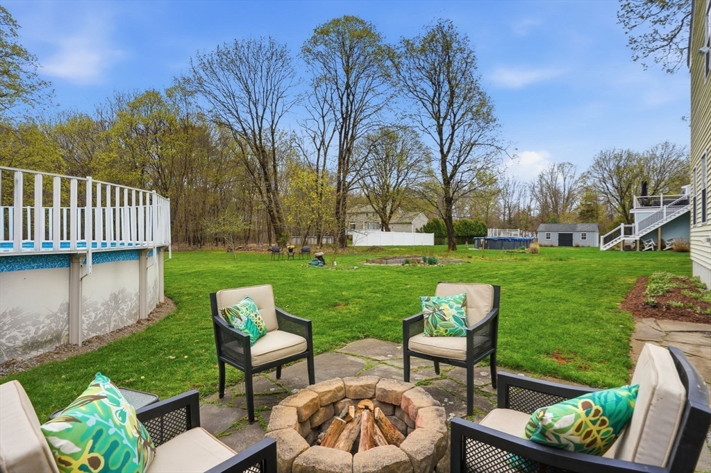 200 Branch Street Mansfield, MA 02048 - Photo 36 of 41 a view of a table and chairs in patio with a yard