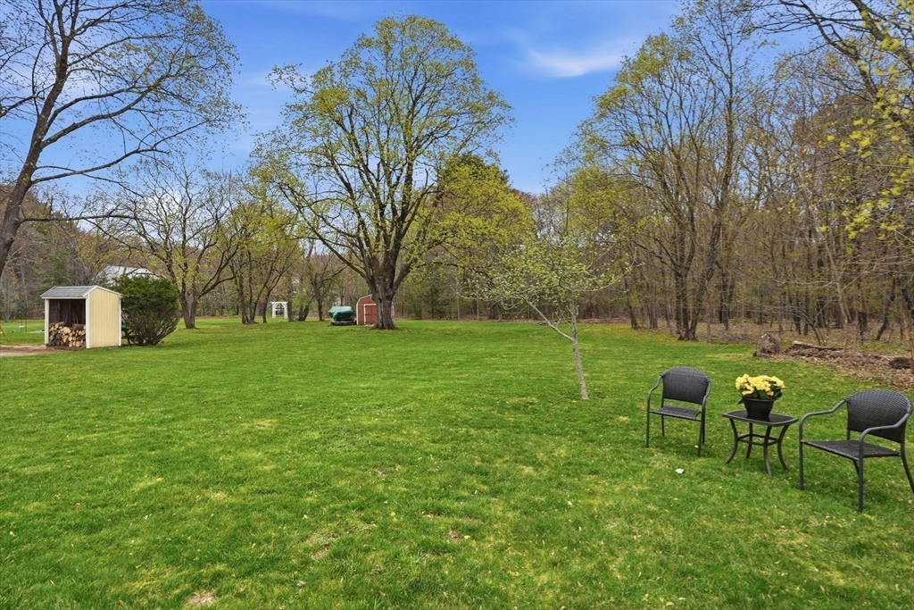 200 Branch Street Mansfield, MA 02048 - Photo 37 of 41 a backyard of a house with table and chairs