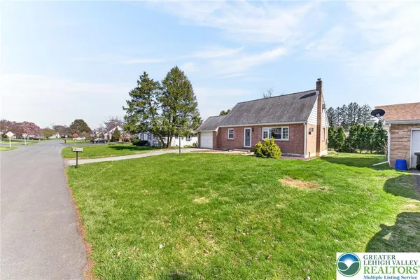 a view of house with outdoor space and street view