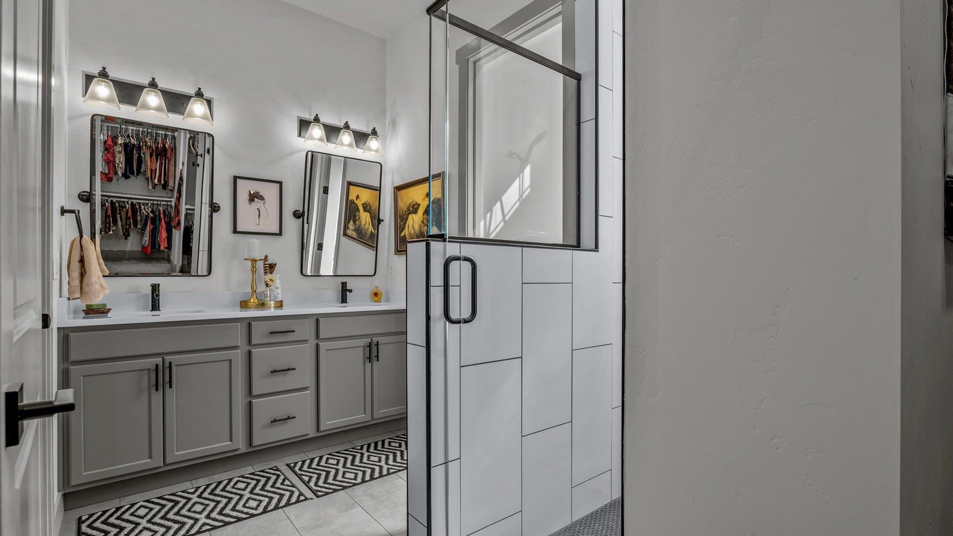 786 Spur Cross Road Grand Junction, CO 81505 - Photo 16 of 27 a bathroom with a sink a mirror and vanity