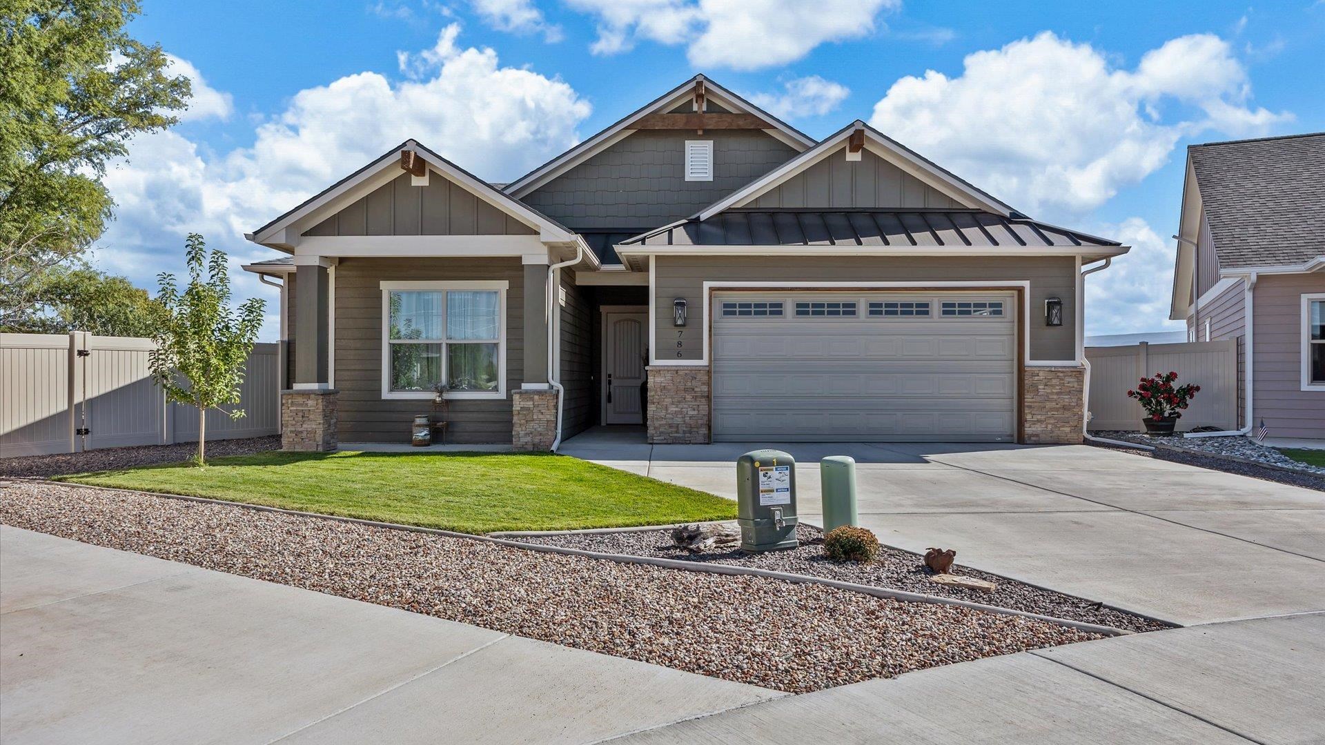 786 Spur Cross Road Grand Junction, CO 81505 - Photo 2 of 27 a front view of a house with garden