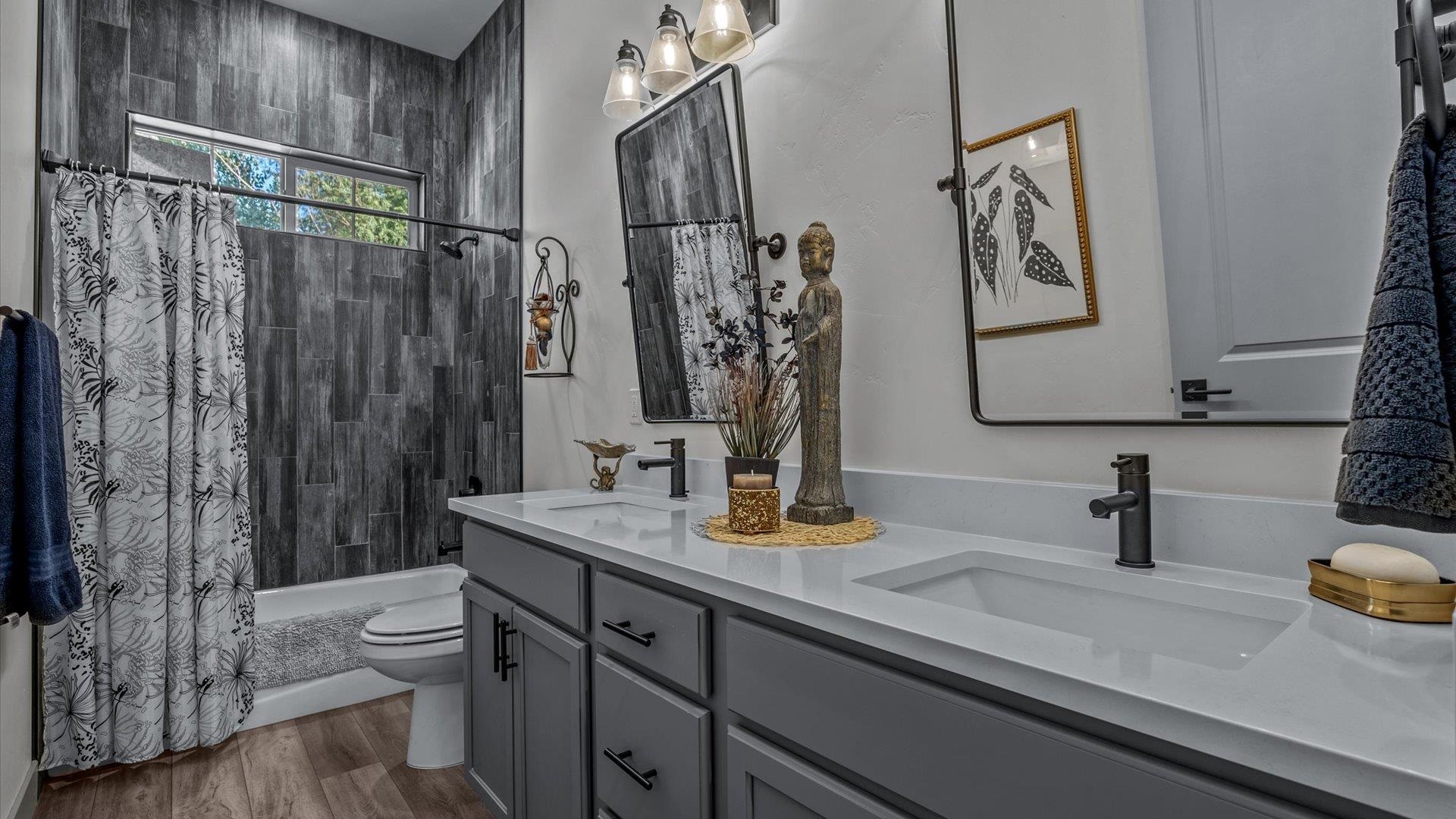 786 Spur Cross Road Grand Junction, CO 81505 - Photo 21 of 27 a bathroom with a sink a toilet and shower