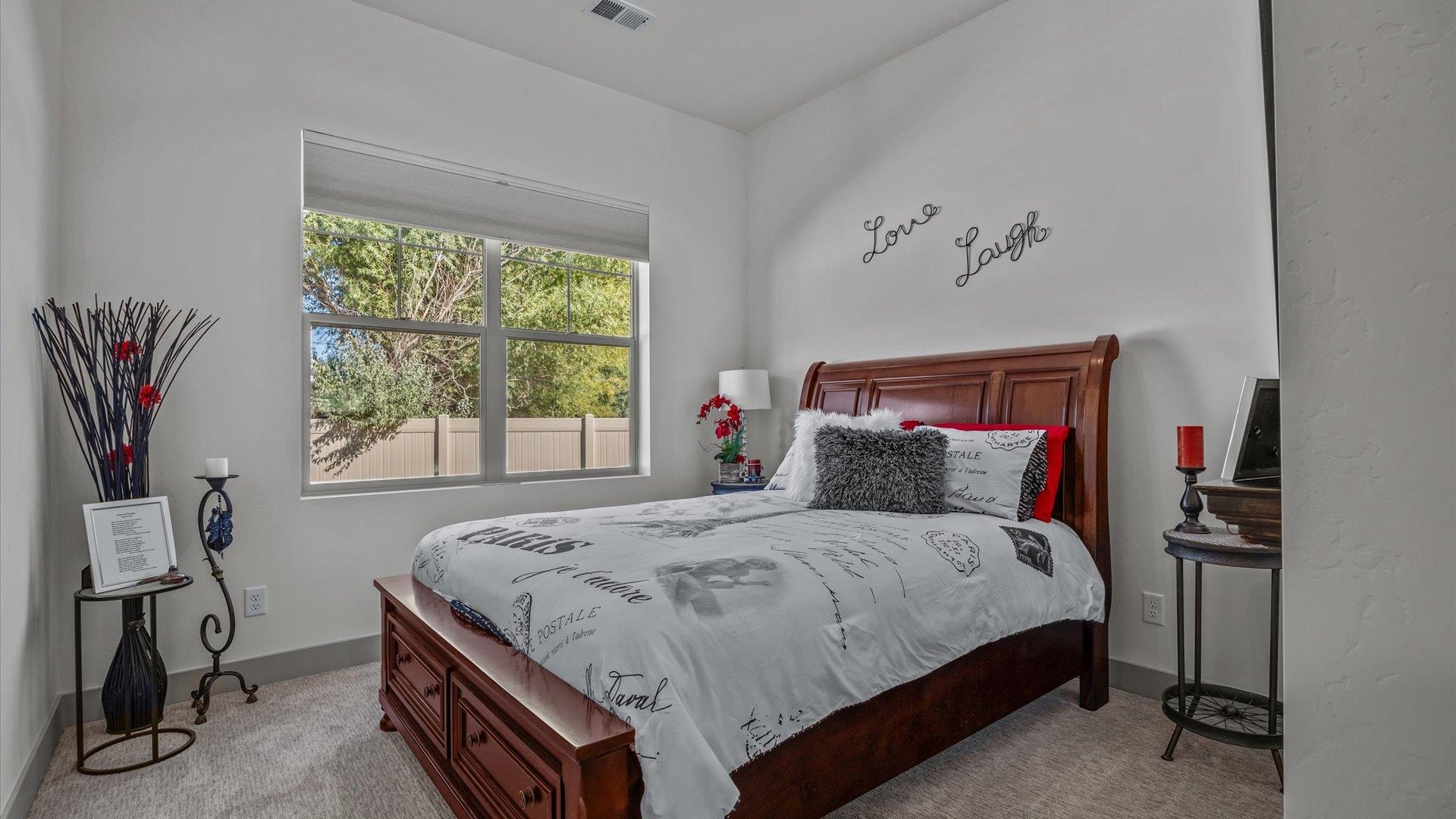 786 Spur Cross Road Grand Junction, CO 81505 - Photo 22 of 27 a bedroom with a bed and a window