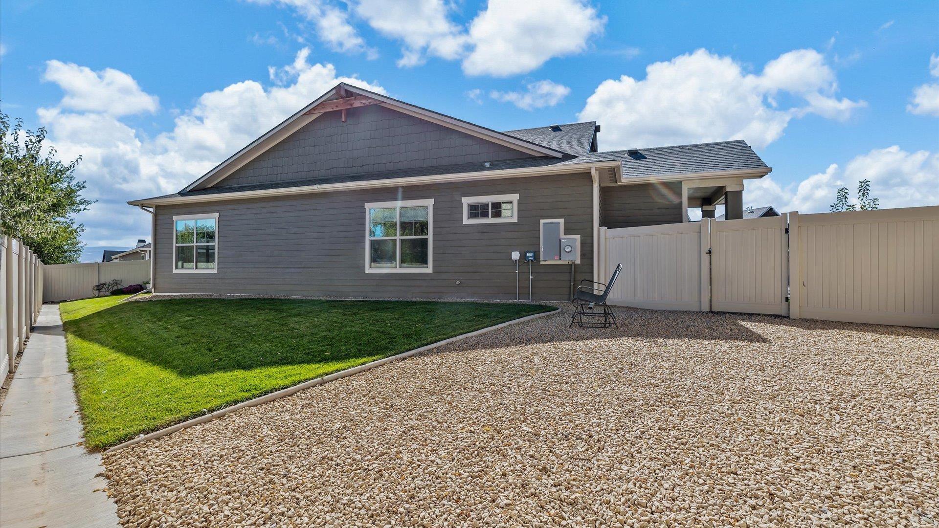 786 Spur Cross Road Grand Junction, CO 81505 - Photo 26 of 27 a front view of a house with a yard