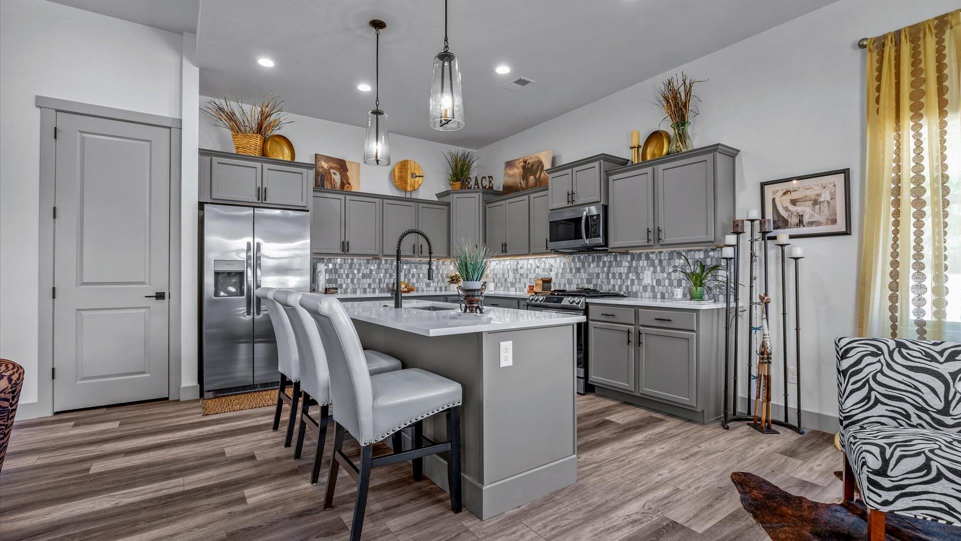 786 Spur Cross Road Grand Junction, CO 81505 - Photo 7 of 27 a kitchen with stainless steel appliances granite countertop a sink refrigerator and microwave