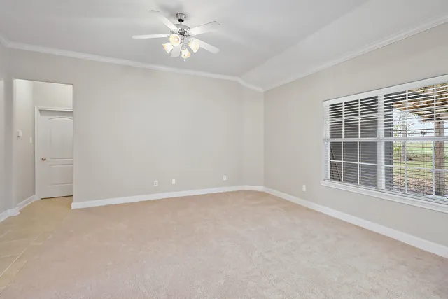 a kitchen with kitchen island granite countertop cabinets and window