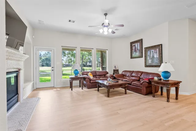 a living room with furniture and a fireplace
