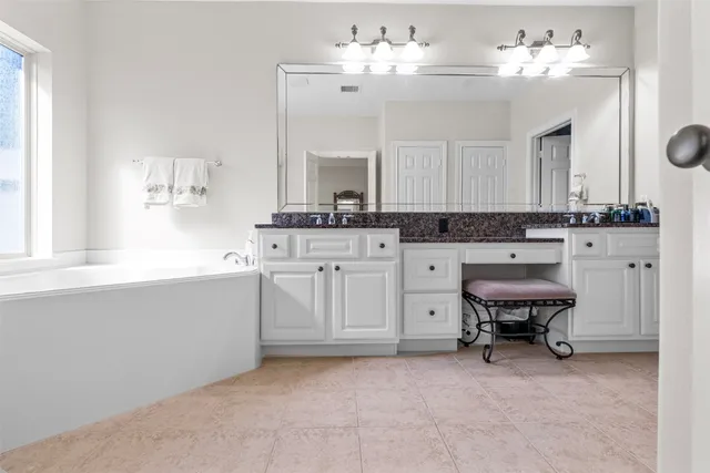 a kitchen with a cabinets and chandelier
