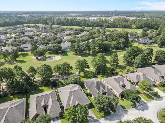 an aerial view of a house with a lake view