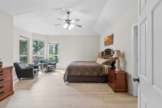 a bedroom with bed and window