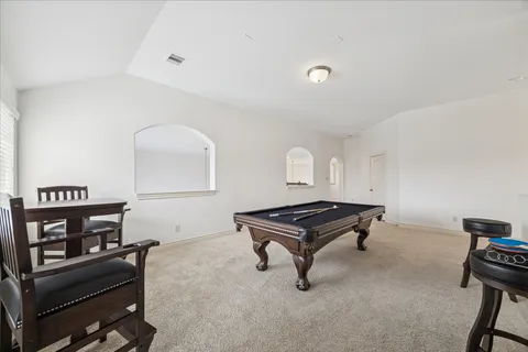 a view of a room with furniture and window