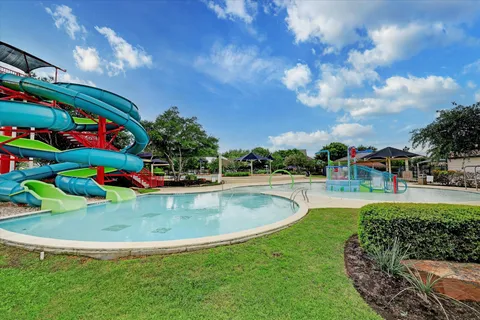 a view of swimming pool with outdoor seating