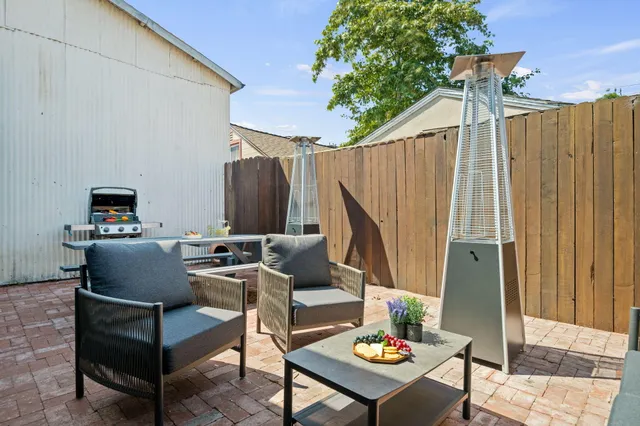 a view of an outdoor sitting area with furniture