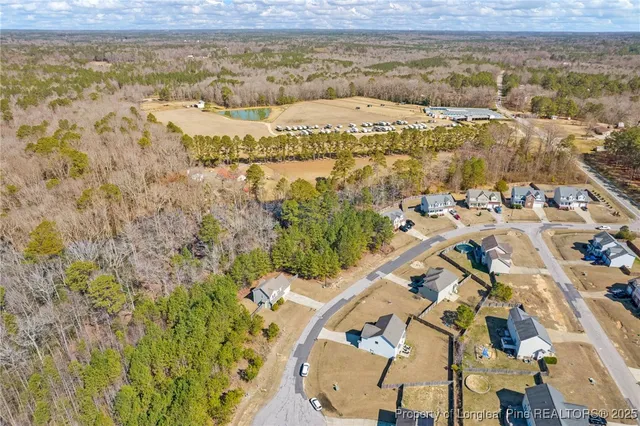 a view of roof deck with chairs and wooden fence